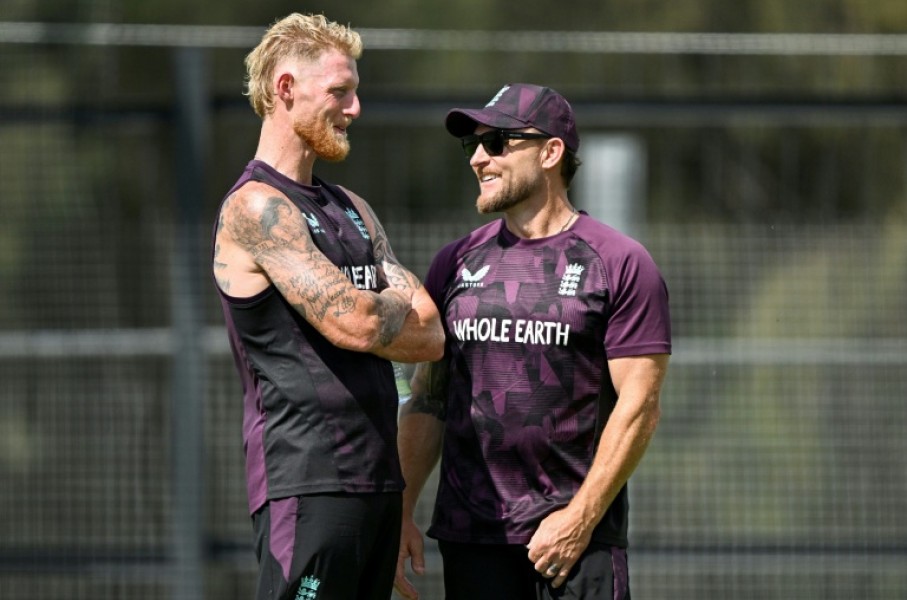 England captain Ben Stokes (L) talks to coach Brendon McCullum