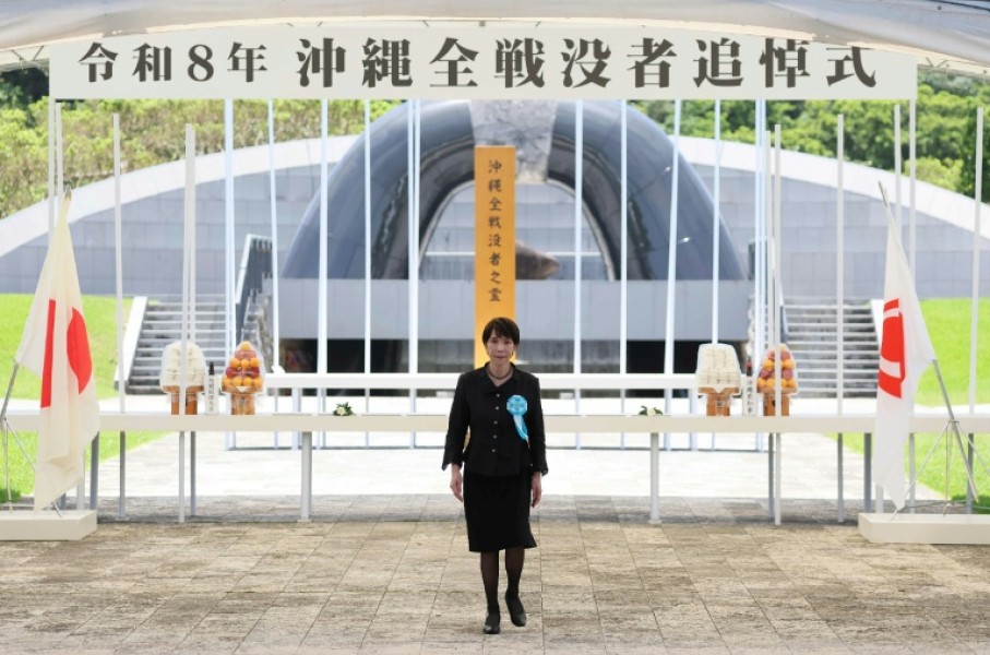 Japan's Prime Minister Sanae Takaichi walks away from the Peace Park Memorial after laying flowers for All War Dead, marking 81 years since the end of the Battle of Okinawa during World War Two