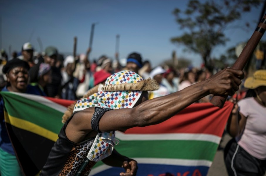 Protests have been fronted by men carrying sticks and shields