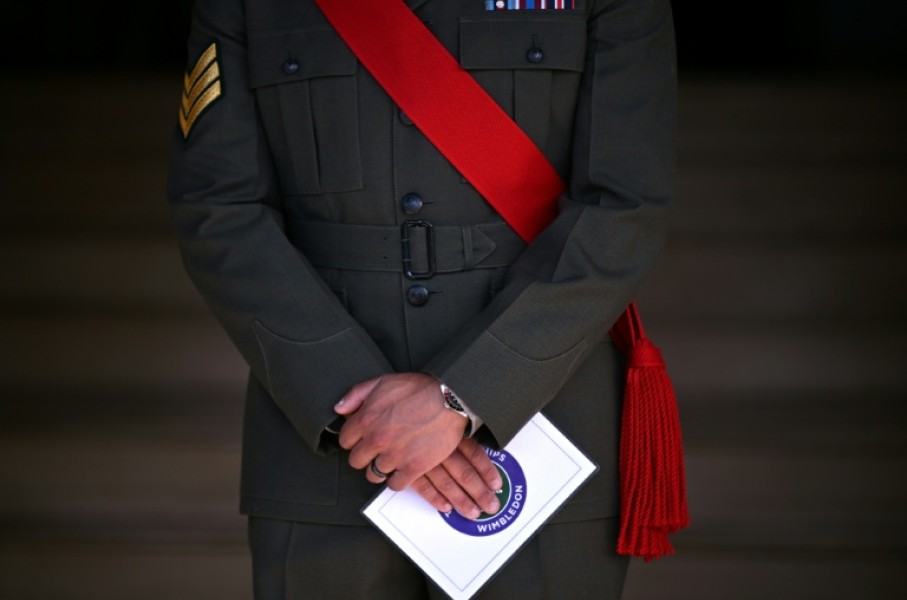 A member of the military stands guard on the first day of the 2026 Wimbledon Championships
