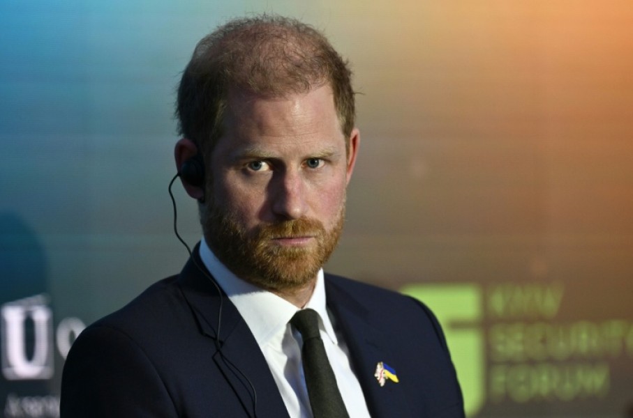 Britain's Prince Harry is due to arrive back in the UK, but without his wife, Meghan, and two children as had originally been planned