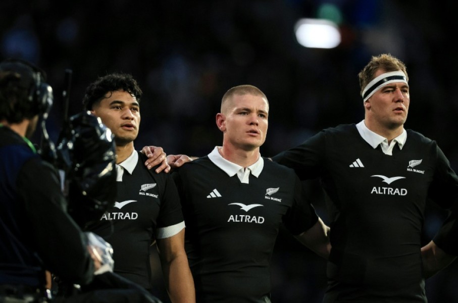 German-born Anton Segner (centre) sings the national anthem as he lines up with fellow All Blacks Wallace Sititi (left) and Sam Darry before the Nations Championship match against Italy in Wellington