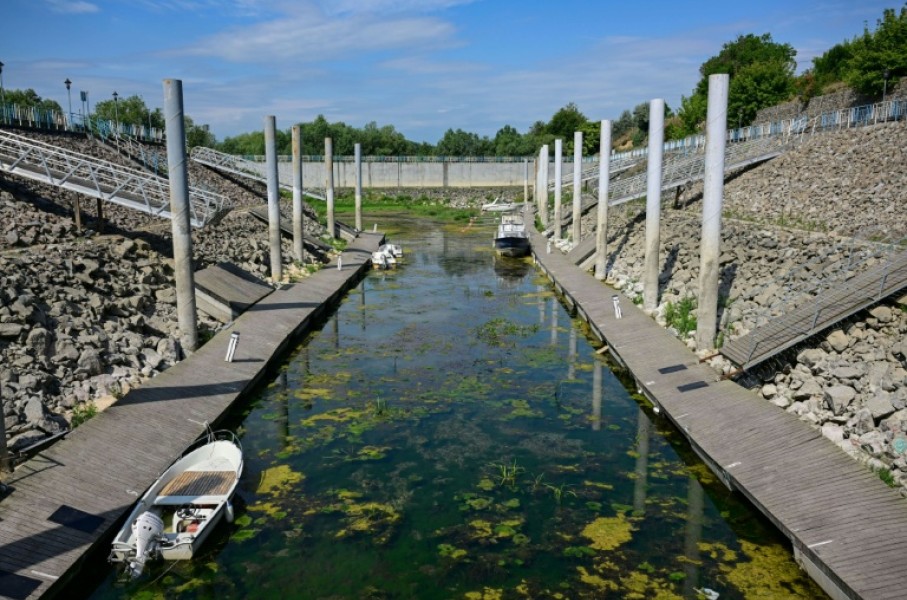 Boats stranded in shallow water in the tourist port in Corabia, southern Romania