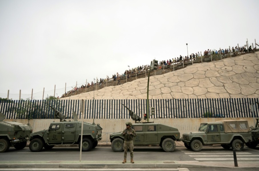 Spain rushed troops, more police, drones, divers and boats to Ceuta