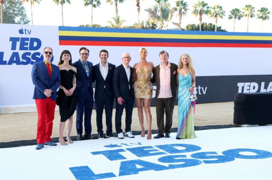 Stars of 'Ted Lasso' gather with Apple CEO Tim Cook at a Los Angeles premiere of the show's fourth season include (L-R): Brendan Hunt, Tanya Reynolds, Jason Sudeikis, John Ternus, Cook, Hannah Waddingham, Jeremy Swift and Juno Temple