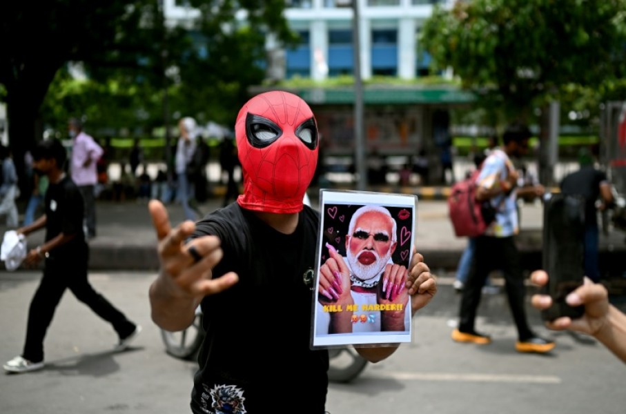 A Cockroach Janta Party supporter holds a doctored picture of India's Prime Minister Narendra Modi at a rally in New Delhi on July 25. Modi said he wanted to "forgive" protesters who abused him