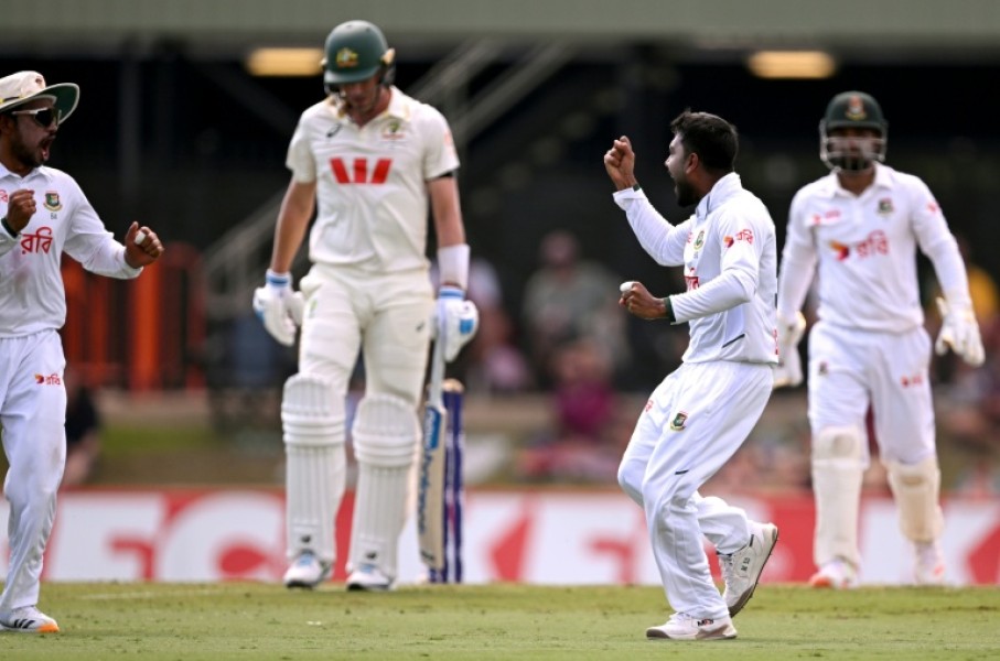 Bangladesh bowler Mehidy Hasan Miraz (2nd R) after dismissing Australia's batsman Pat Cummins in Darwin
