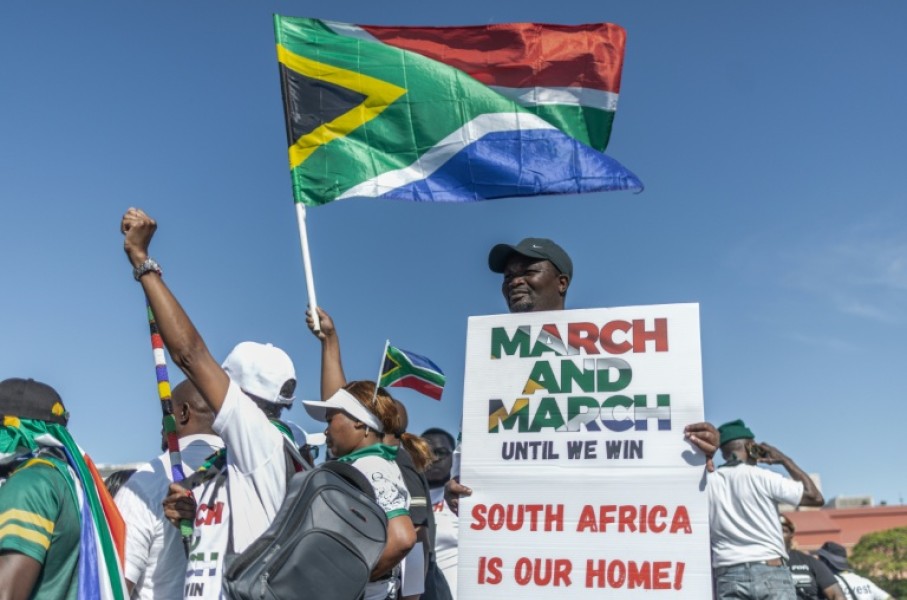 Anti-migrant protesters gathered outside the venue of a southern Africa regional summit