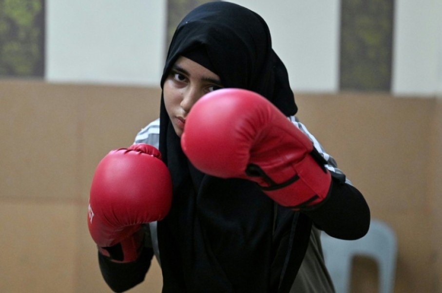 Hoorain Zahra shadow-boxing during a sparring session at a local boxing club in Karachi's Lyari town