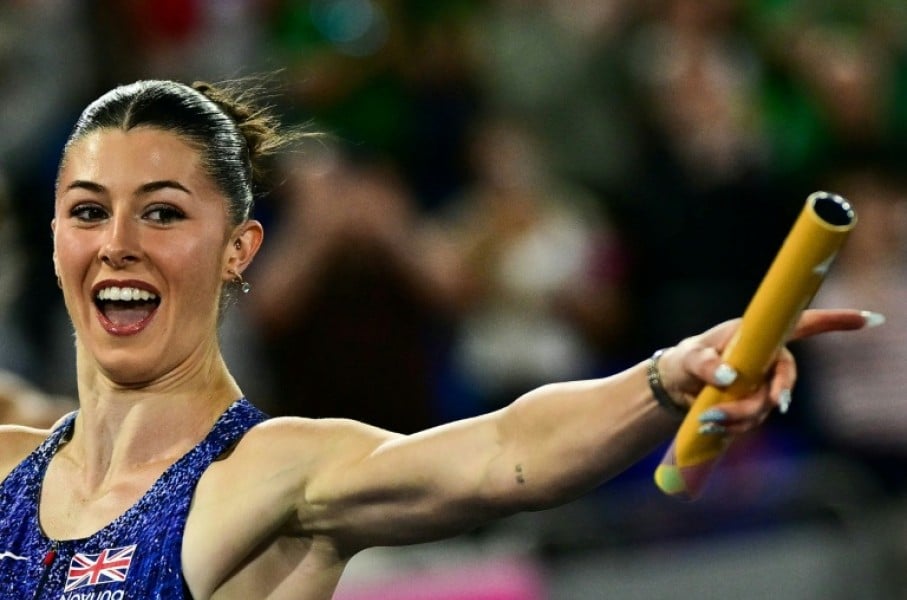 Britain's Amy Hunt celebrates as she crosses the finish line in the European 4x100m mixed relay