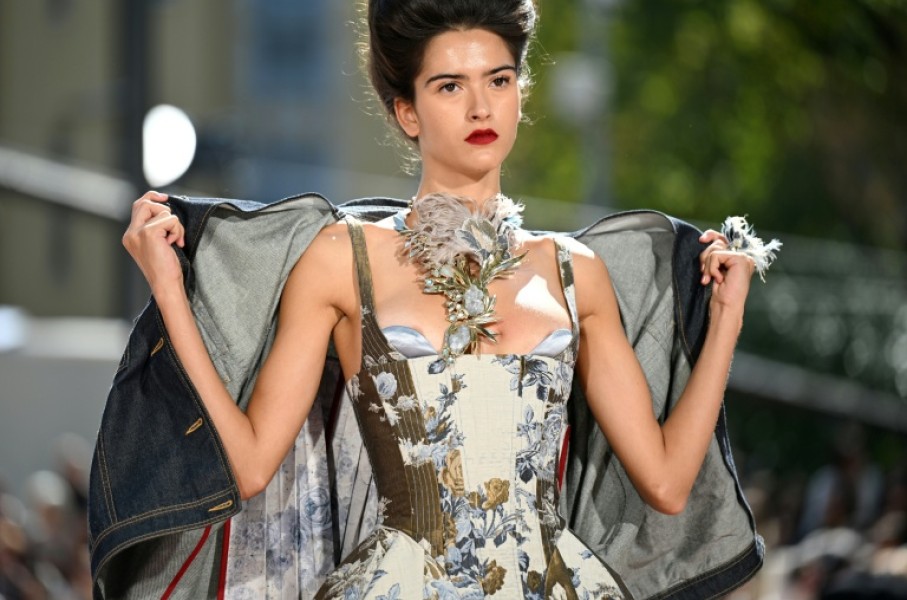 Sardinian designer Antonio Marras presented wide grey suits embroidered with flowers nostalgic silk or tulle dresses and deconstructed parkas