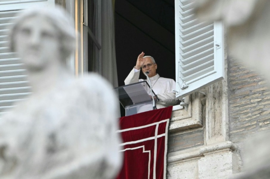 Resolved to resume working "gradually" after surgery, the pope blesses the crowd from the window of the apostolic palace overlooking St. Peter's square