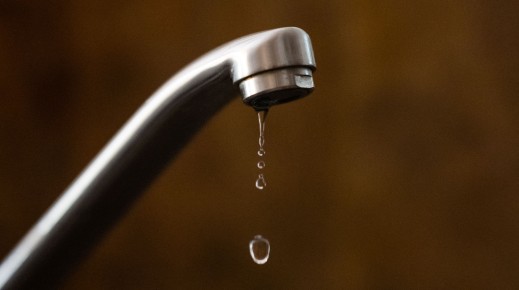 File: Drop of water sinking from a tap.  LOIC VENANCE / AFP