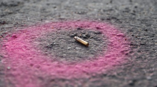 File: A spent casing is highlighted by the police at a crime scene. AFP/Guillem Sartorio