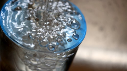 File:  Tap water flows into a glass.  