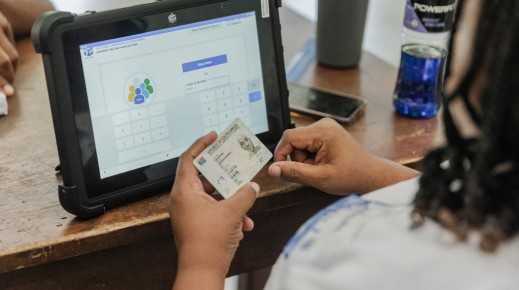 An IEC official checks an ID. AFP/Rajesh Jantilal
