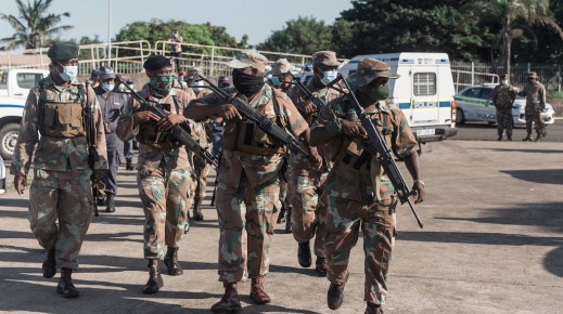 File: SANDF members walk as they take part in a law enforcement operation. AFP/Rajesh Jantilal