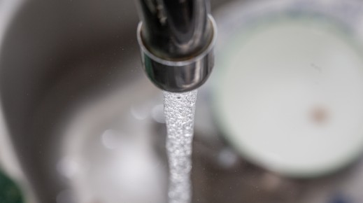 File: An open tap with water flowing from it. Romain Costaseca/Hans Lucas via AFP