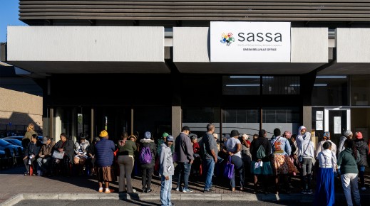 People queue outside the SASSA office to exchange SASSA cards for the new Postbank Black Cards. Gallo Images/Die Burger/Jaco Marais