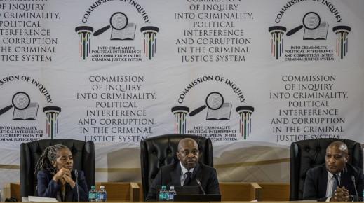 Justice Mbuyiseni Madlanga delivers his remarks during the judicial commission of inquiry probing Provincial Police Commissioner Nhlanhla Mkhwanazi's claims. AFP/Phill Magakoe
