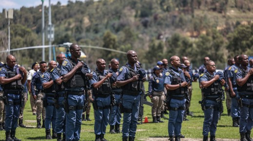 Members of the South African Police Service (SAPS) stand at attention during the Integrated Law Enforcement parade near the Nasrec Expo Centre in Johannesburg, on November 19, 2025.