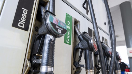 File: Fuel nozzles hang in the holder at a filling station. Peter Kneffel/dpa via AFP