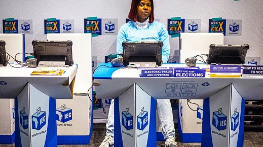 An official sits at a voter registration table at the launch event for the 2026 Municipal elections. Per-Anders Pettersson/Getty Images