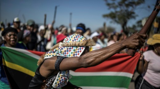 Protests have been fronted by men carrying sticks and shields