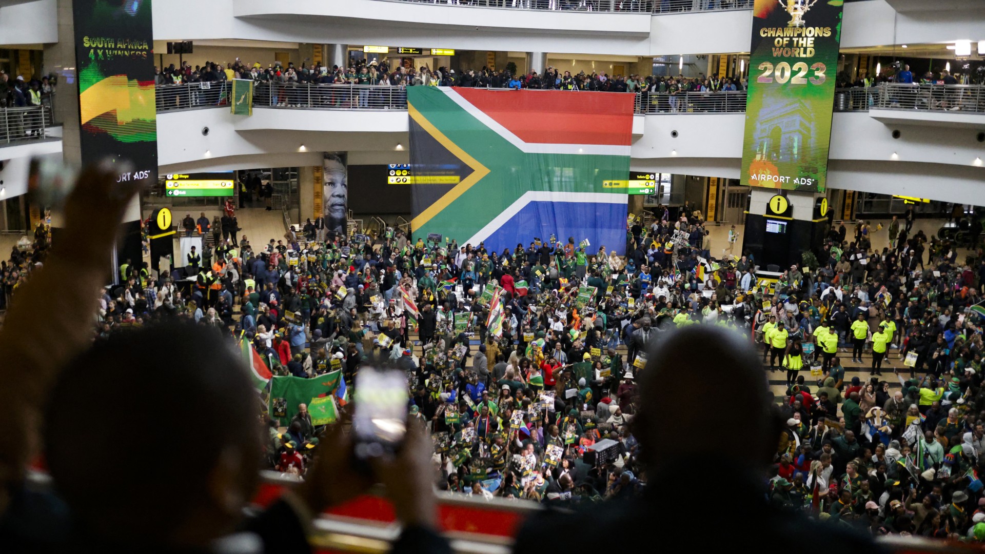Supporters wait ahead of the South African rugby team's arrival at the OR Tambo International airport in Ekurhuleni on October 31, 2023, after they won the France 2023 Rugby World Cup final match against New Zealand.