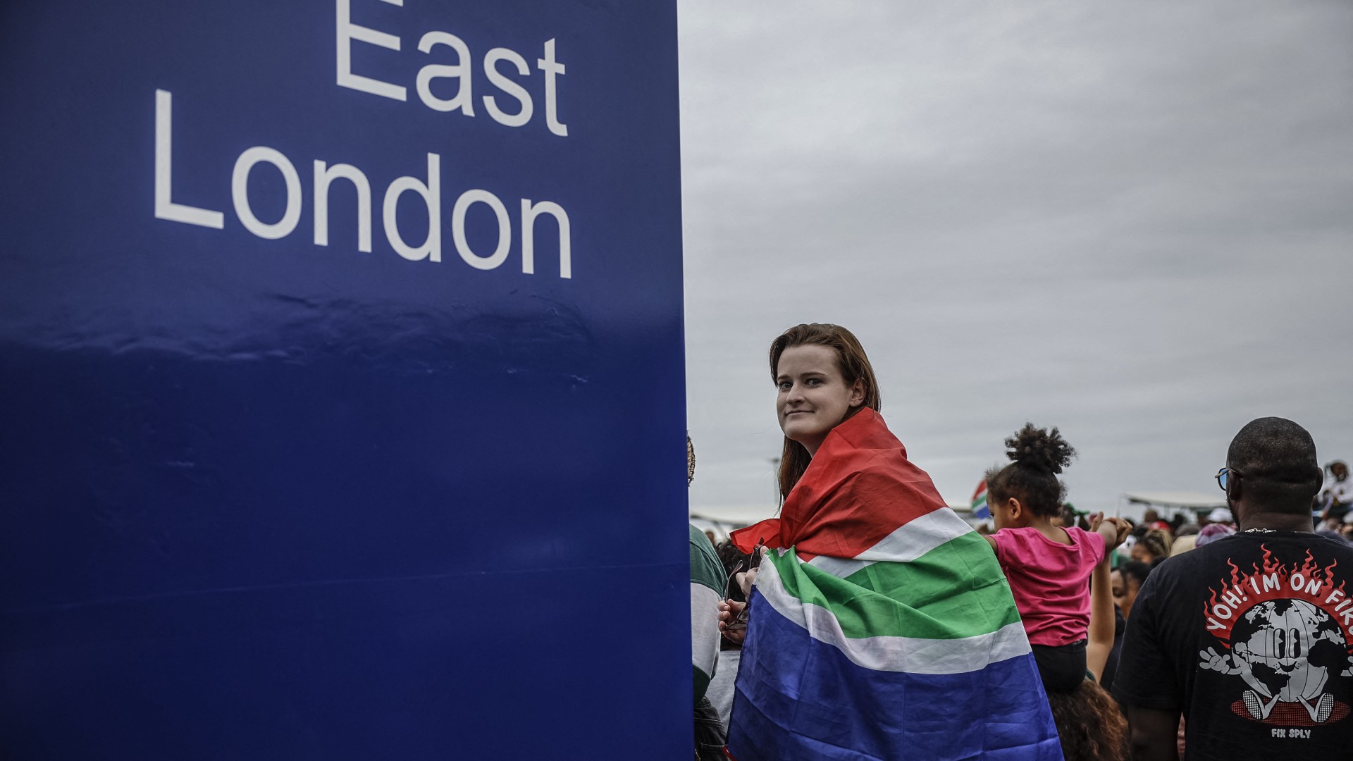 A supporter wears a South African flag during the Springboks Champions trophy tour in East London, South Africa, on November 5, 2023, after South Africa won the France 2023 Rugby World Cup final match against New Zealand.