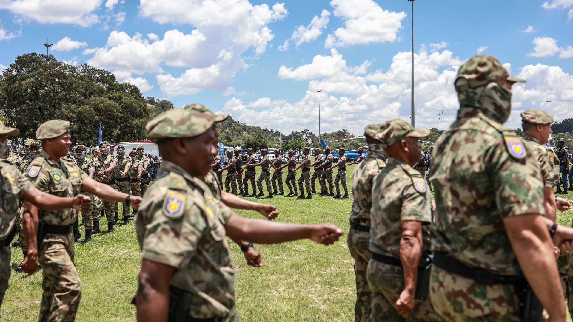 Members of the South African Police Service (SAPS) Special Task Force march during the Integrated Law Enforcement parade near the Nasrec Expo Centre in Johannesburg, on November 19, 2025.