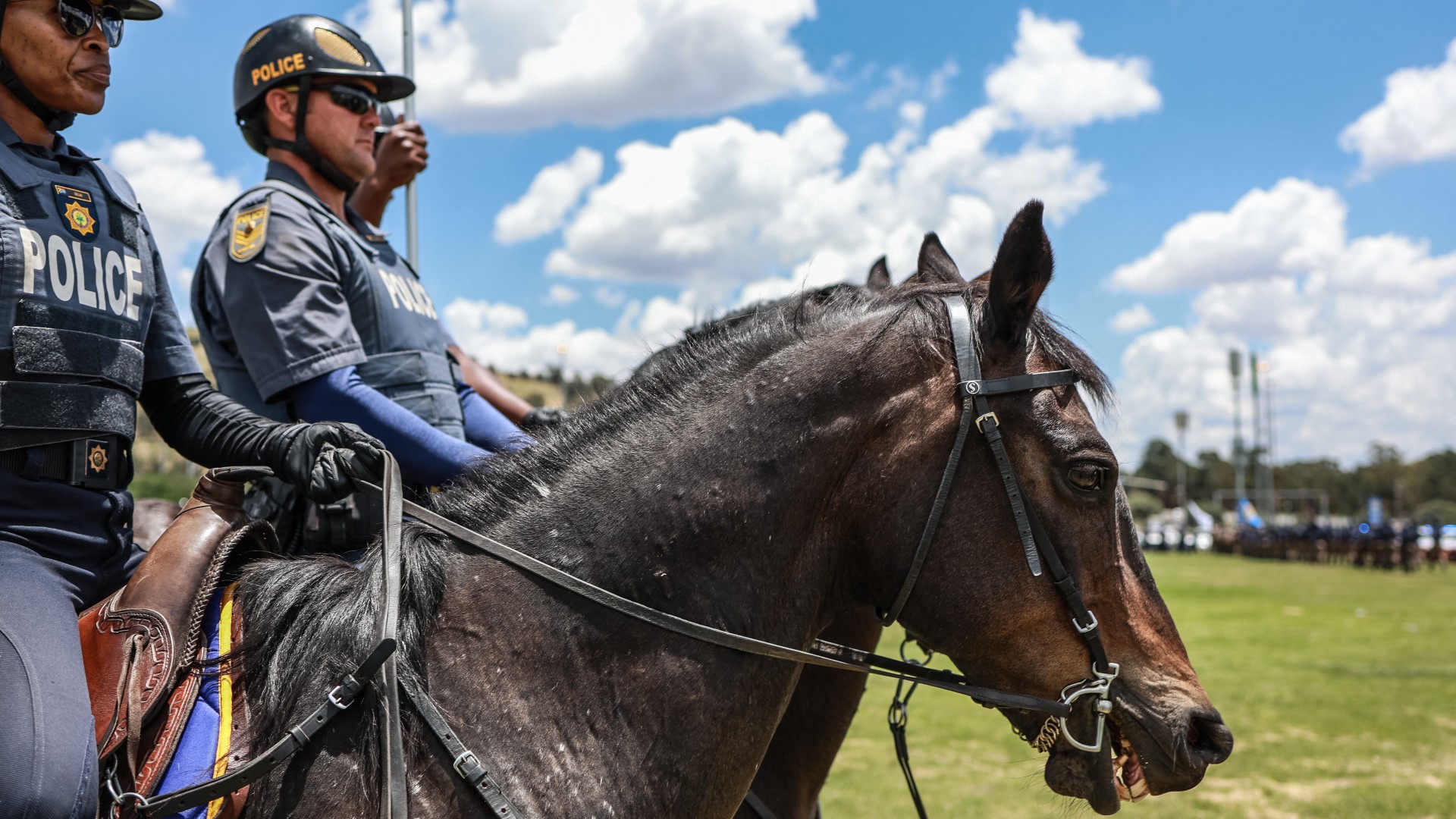 Members of the South African Police Service (SAPS) Mounted Unit join a march during the Integrated Law Enforcement parade near the Nasrec Expo Centre in Johannesburg, on November 19, 2025.