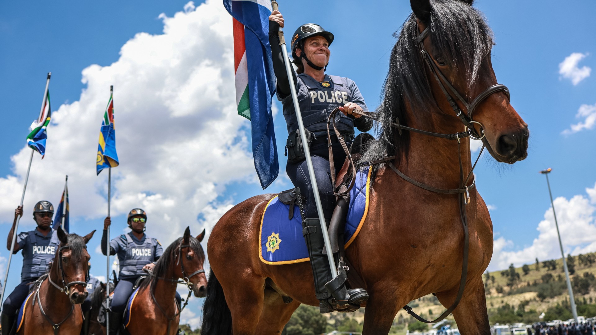 Members of the South African Police Service (SAPS) Mounted Unit join a march during the Integrated Law Enforcement parade near the Nasrec Expo Centre in Johannesburg, on November 19, 2025.