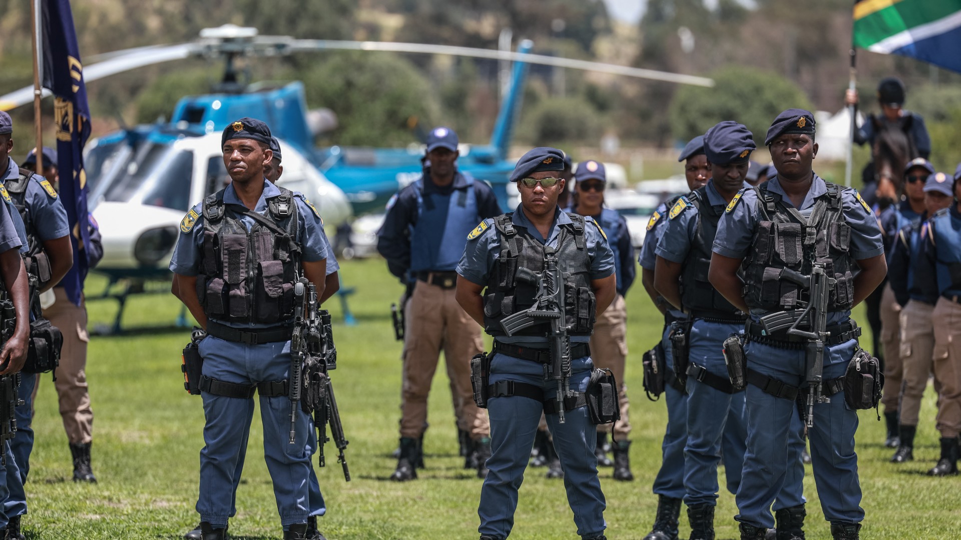 Members of the South African Police Service (SAPS) stand at attention during the Integrated Law Enforcement parade near the Nasrec Expo Centre in Johannesburg, on November 19, 2025.