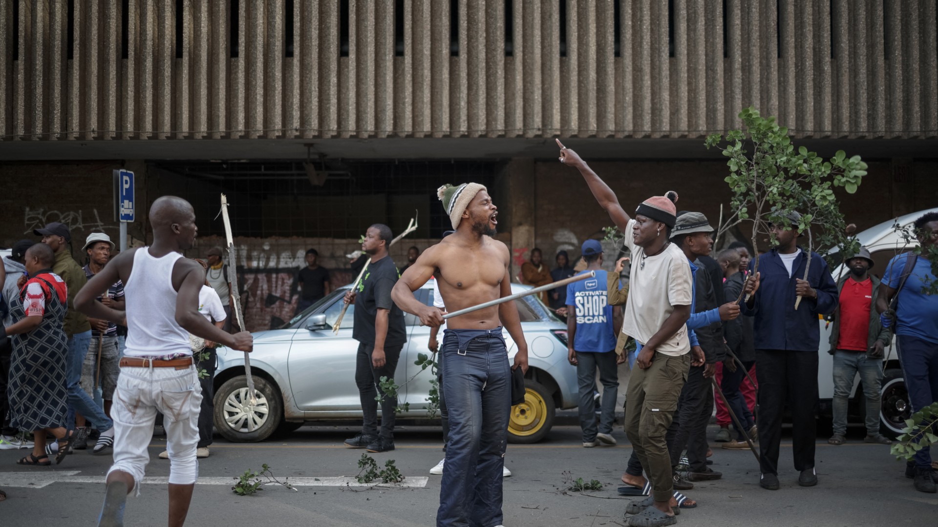 Protestors gesture in the street during a protest march against undocumented migrants organised by “March and March” in Johannesburg on April 29, 2026.