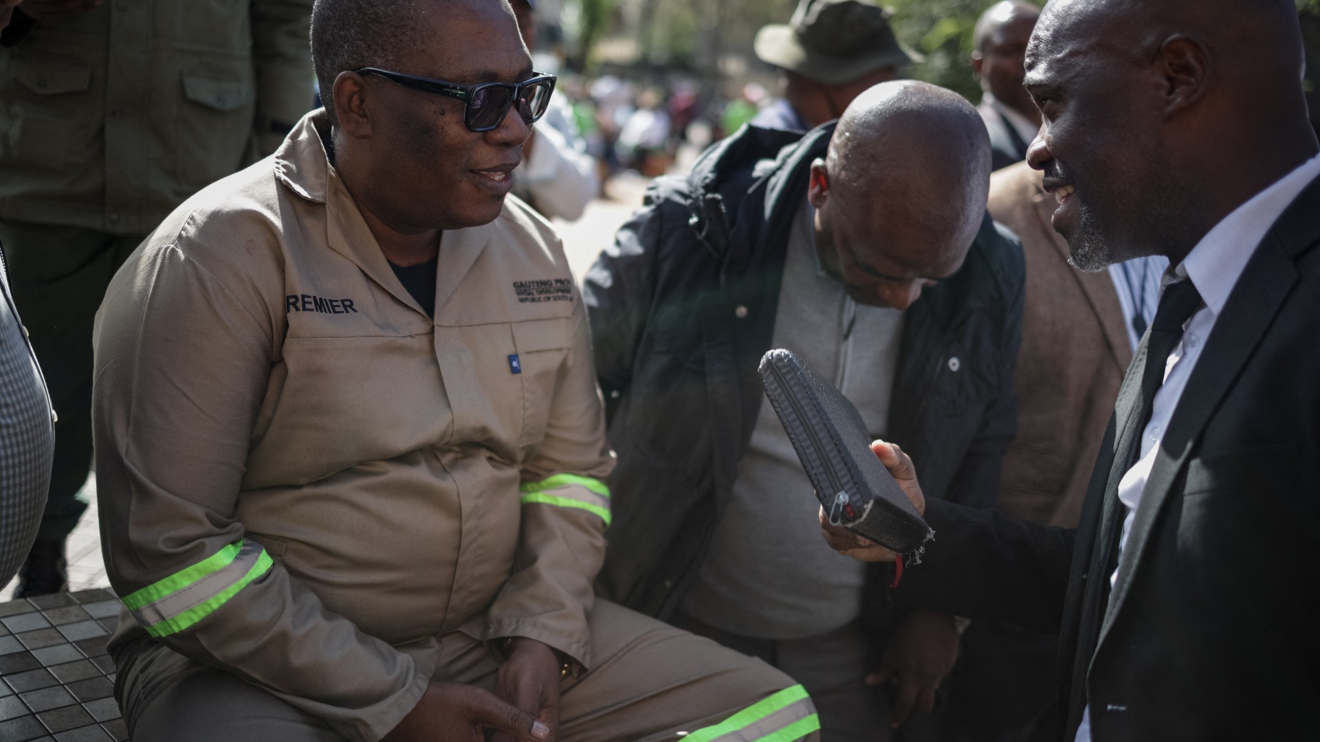 South Africa's Gauteng Province Premier Panyaza Lesufi (L) speaks with Evangelist Sipho Trevor Dlamini (R) before protesters handed him a memorandum during a protest march against undocumented migrants organised by “March and March” in Johannesburg on April 29, 2026.