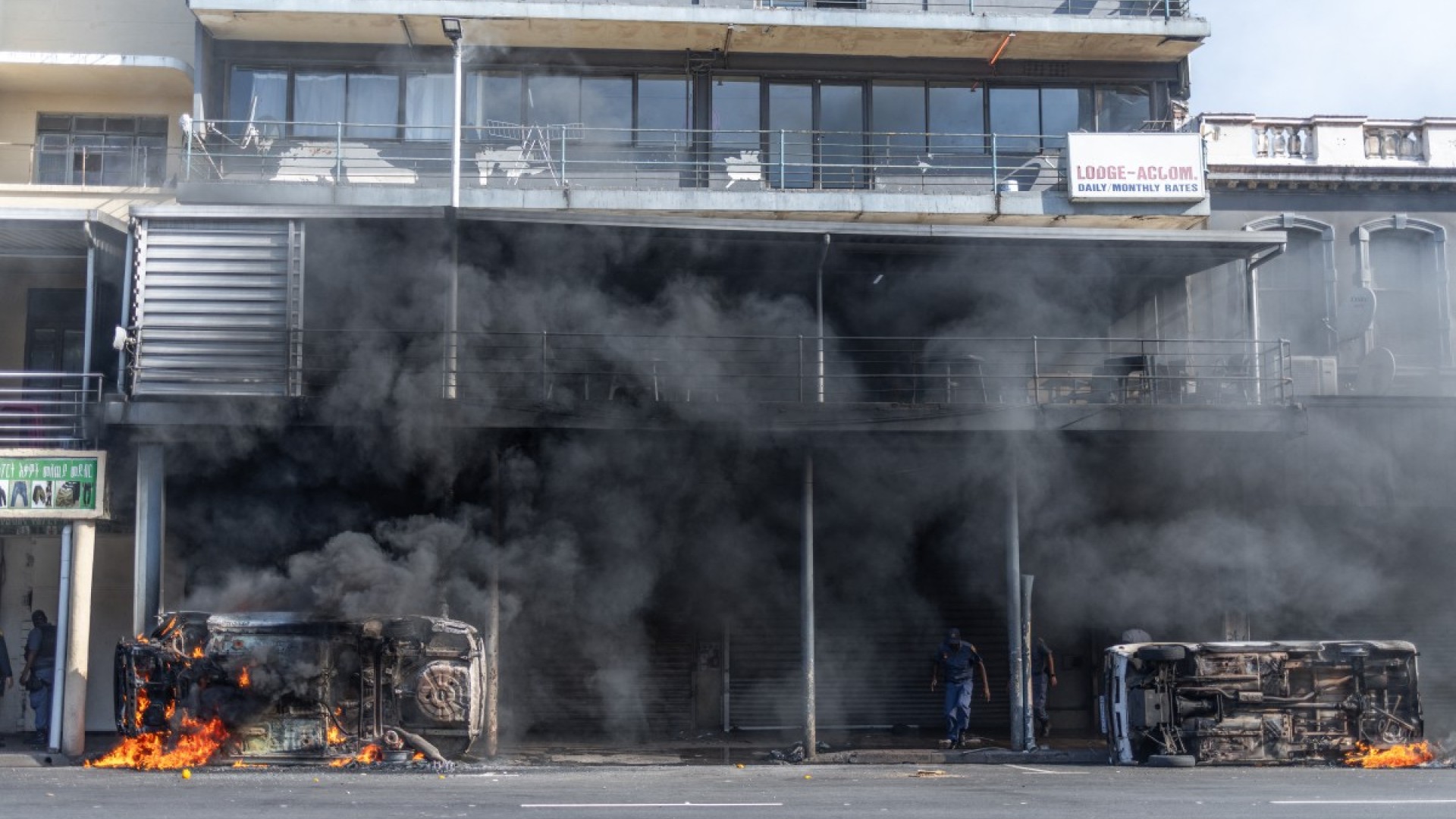 Cars are set alight after clashes erupt between protesters and foreign nationals in Durban on October 8, 2026.