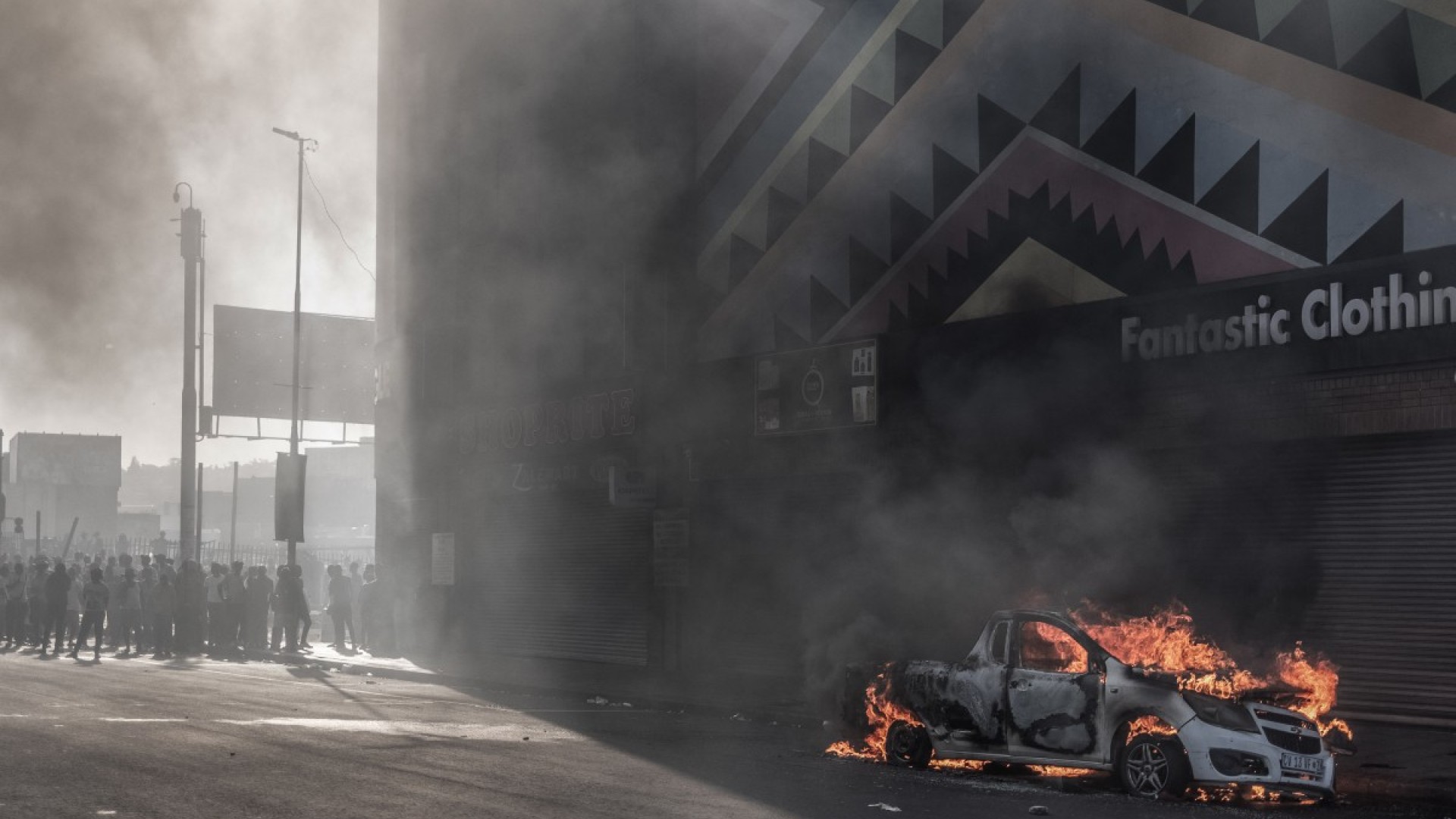 A car is set alight after clashes erupted between protesters and foreign nationals in Durban on October 8, 2026