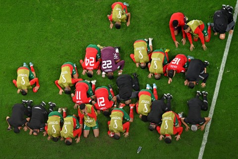 Morocco's players celebrate at the end of the Qatar 2022 World Cup round of 16 football match between Morocco and Spain at the Education City Stadium in Al-Rayyan, west of Doha on December 6, 2022.