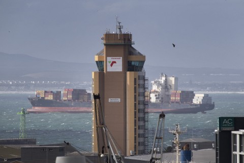 File: A ship moors outside Cape Town harbour, behind the harbour-control tower of Transnet, the State-owned Transport/Logistics company.