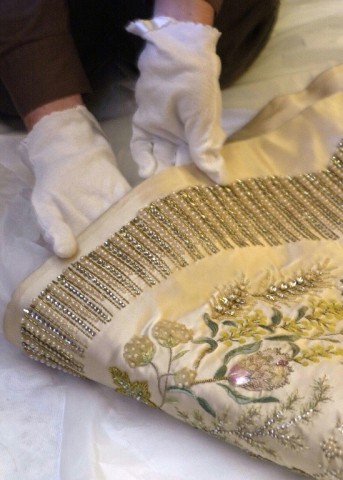 Queen Elizabeth II's Coronation Gown was embroidered in gold, silver, green and pink