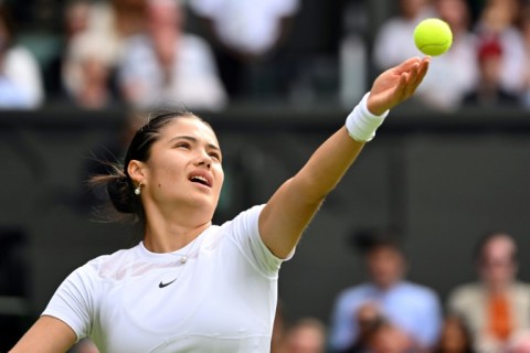 Emma Raducanu serves during her defeat to Caroline Garcia in the second round at Wimbledon