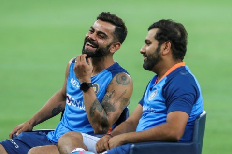 India's Virat Kohli (L) and Rohit Sharma sit for an interview at the end of the Asia Cup Super Four match in Dubai on Thursday