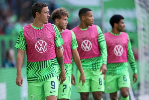 Wolfsburg's German forward Max Kruse (L) has been told his days are over at the club. 