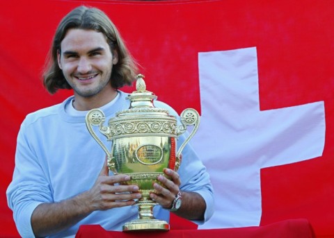 First timer: Federer poses with the Wimbledon trophy after defeating Mark Philippoussis in the 2003 final