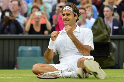 Victory celebration: Federer falls to the floor after defeating Andy Murray in the 2012 final