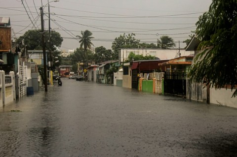 A flooded road is seen during the passage of Hurricane Fiona in Villa Blanca, Puerto Rico
