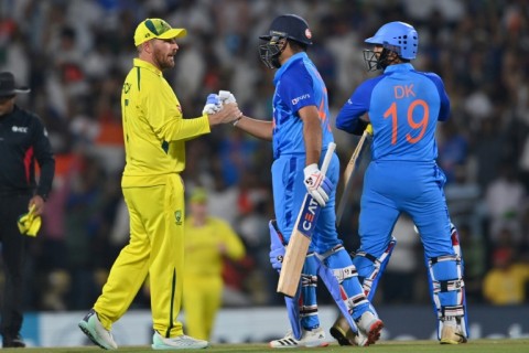 Australian captain Aaron Finch (left) congratulates his Indian counterpart Rohit Sharma 