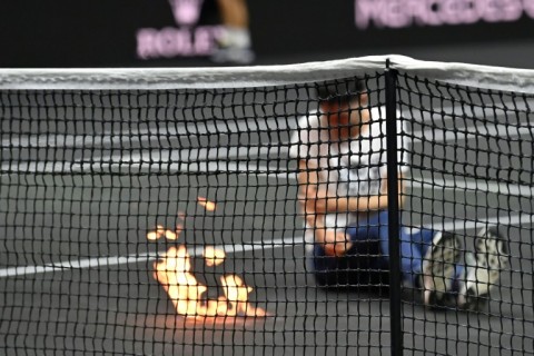 A protester set fire to his arm at the Laver Cup in London