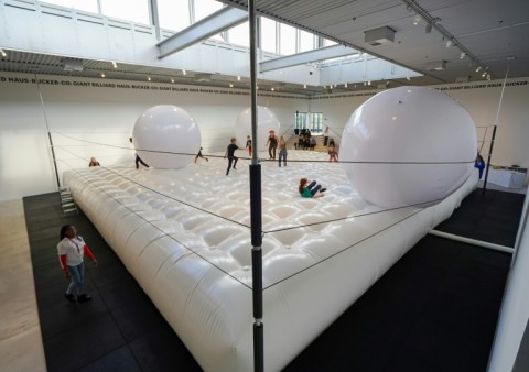 The installation looks like a bouncy game of giant-sized billiards
